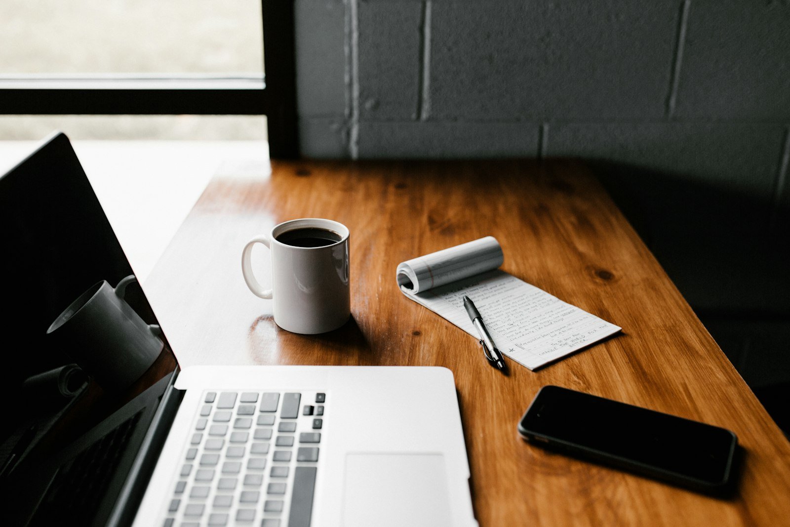 Daily habits of successful people shown at a focused workspace